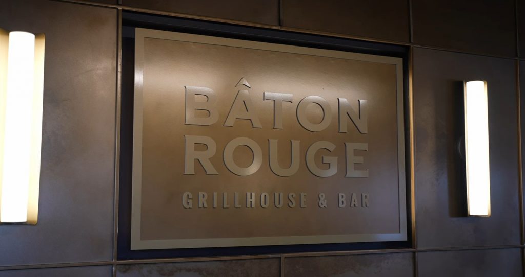Signage for Bâton Rouge Grillhouse & Bar with modern lighting accents.